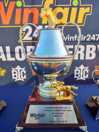 The Winfair247 Bangalore Derby trophy, a classic design with a golden horse finial.