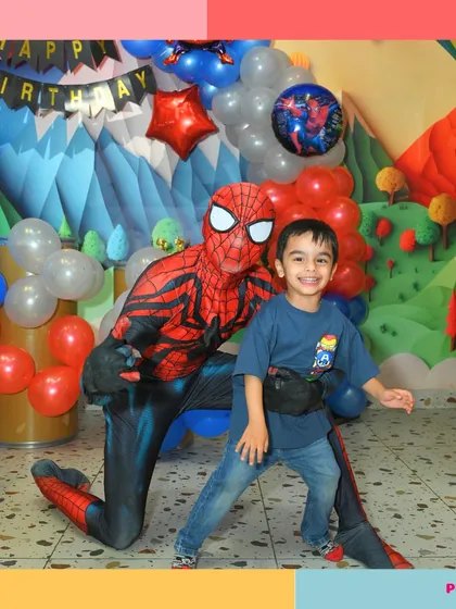 A huge smile from this birthday boy as he poses with his hero, Spider-Man.