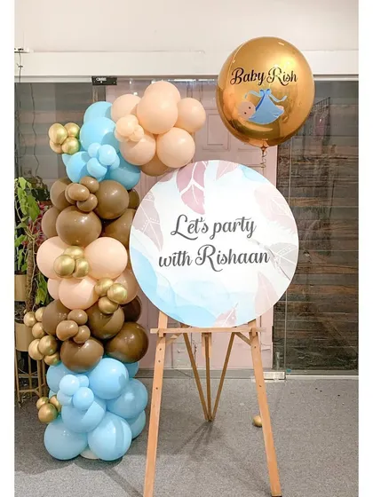 "Let's party with Rishaan!" This welcome easel uses a trendy teddy bear color palette of brown, beige, and baby blue. It's a modern and fun way to set the tone for a stylish baby shower or first birthday party.