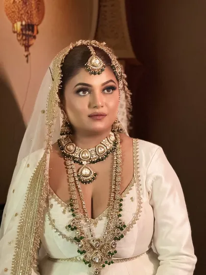 Another portrait from the Umrao Jaan series. The makeup is soft and ethereal, with a focus on the expressive eyes.