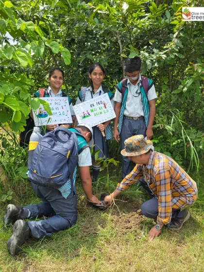 Students from the school's Eco Club get down to the serious business of planting. Their enthusiasm and dedication are truly inspiring.