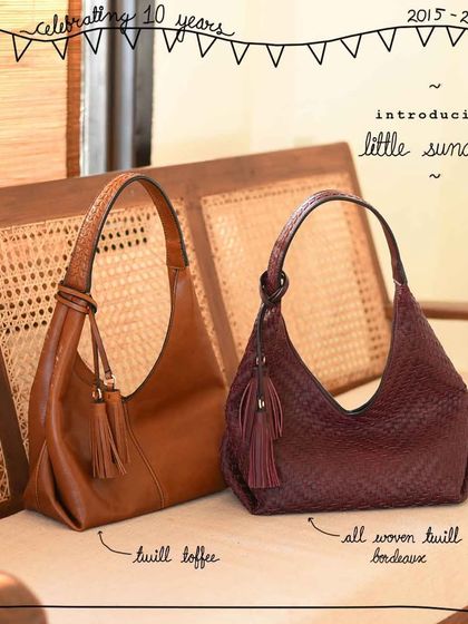 Introducing the Little Sunaina in two distinct styles. The Twill Toffee offers a classic, smooth leather look with a detailed handle, while the All Woven Twill Bordeaux provides rich, all-over texture in a deep, elegant color.
