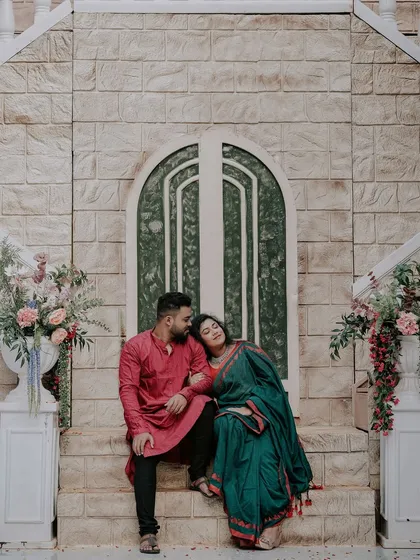 Another tender moment on the steps of the same set, perfect for capturing romantic and candid-style photos.