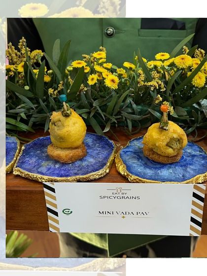 Mini Vada Pavs served on beautiful blue agate coasters. These bite-sized versions of the Mumbai classic are a creative and delicious appetizer for any celebration.