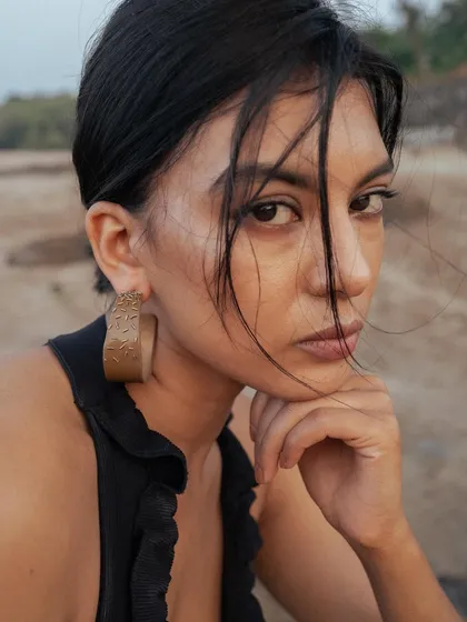Another portrait from the Noupelle Studio jewelry shoot. The makeup is minimal and the hair is styled with loose, wind-swept pieces to create an effortlessly chic look.