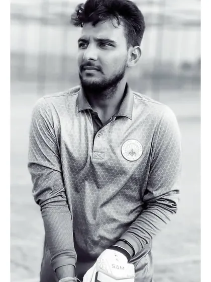 A black and white portrait of our player Kamal Yadav, who represented the Haryana Under-19 team in the Vinoo Mankad Trophy.