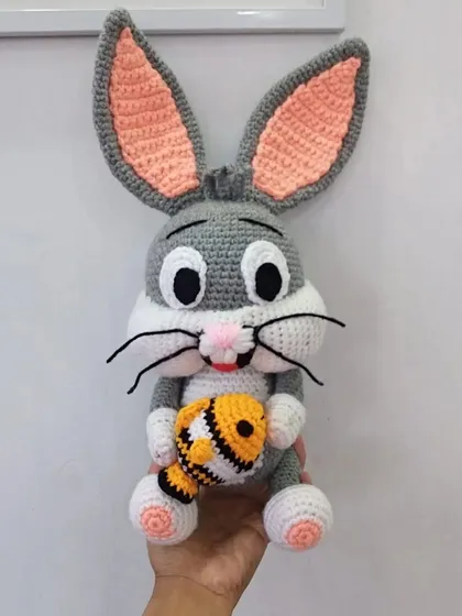 A clear, bright shot of the handmade Bugs Bunny doll, showing the clean stitch work and character details.