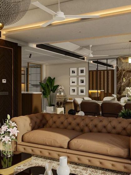 A design rendering of a living space, illustrating our vision for combining classic forms like the Chesterfield sofa with modern elements such as a marble-clad accent wall and recessed lighting.