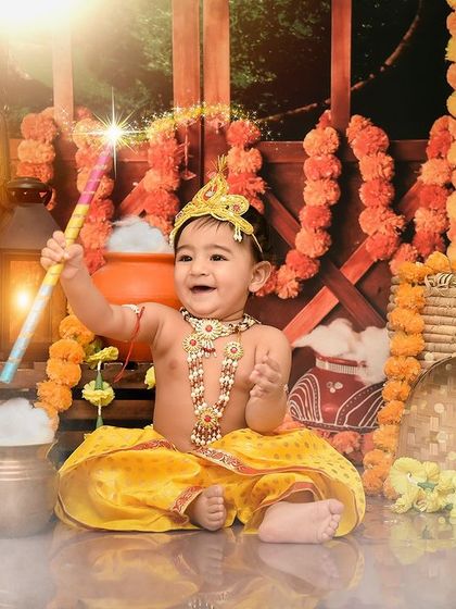 Waving a magic wand in our Janmashtami setup. This shot captures the playful and enchanting spirit of Lord Krishna.