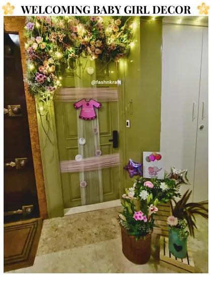 We celebrated the arrival of a little princess with this charming elephant-themed welcome decor. The setup included a floral arch over the door, fairy lights, and cute pink details, perfect for a baby girl's homecoming.
