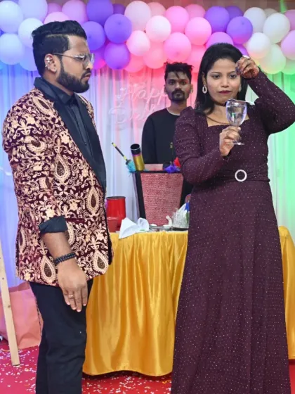 A guest from the audience is amazed as a live fish appears in a glass of water she was holding. This is one of my most requested illusions for its sheer impossibility.