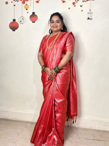 The bride looks happy and confident in her engagement attire. The hairstyle is both beautiful and secure, ensuring she can enjoy her day without any worries.