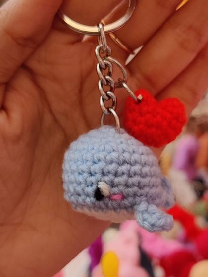 A tiny blue whale keychain with a little heart charm.