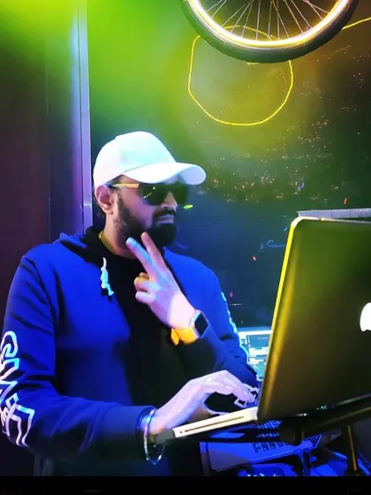 A shot from a gig in Dubai. The neon lights and my laptop are all I need to get the party started.