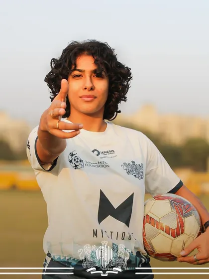 "I see you." A player points confidently, ready to take on any challenge on the field.