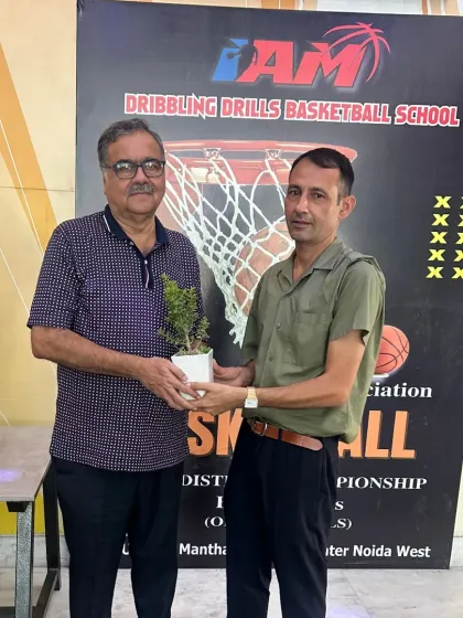 An official from the District Basketball Association being honored at one of our tournaments. We work closely with local sports bodies.