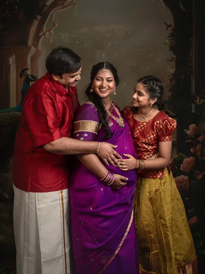 A candid moment of love and affection within the formal setting. The family's interaction brings warmth and life to the classical composition.