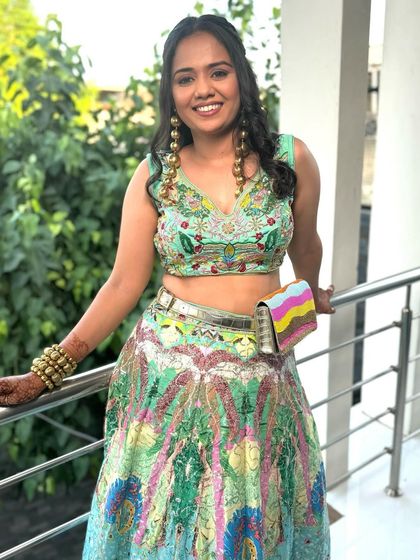 Another shot of this vibrant and rebellious chic look. The makeup is kept minimal and glowing to let the colorful outfit and bold accessories do all the talking.