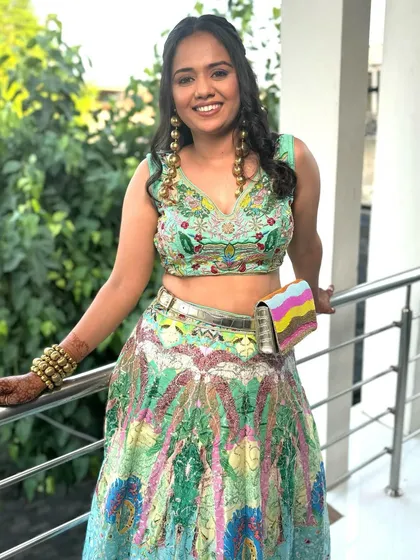 Another shot of this vibrant and rebellious chic look. The makeup is kept minimal and glowing to let the colorful outfit and bold accessories do all the talking.