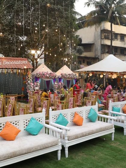 Another view of our charming outdoor Mehendi setup. We combine different seating styles, including lounge sofas and tented areas, to create a dynamic and comfortable space for guests to mingle.