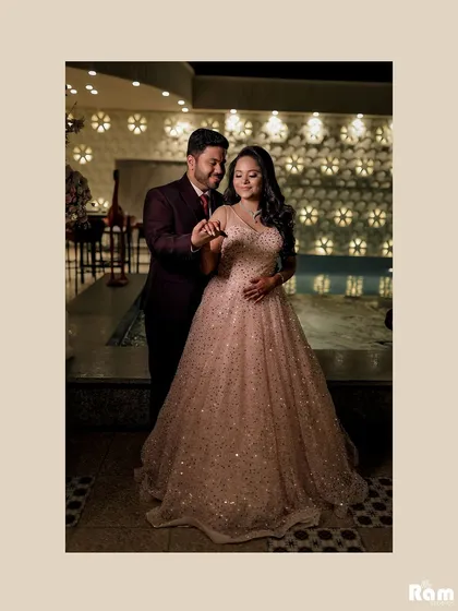 A romantic portrait of the couple dancing at their engagement party. The warm lighting and their close hold create an intimate and celebratory feel.