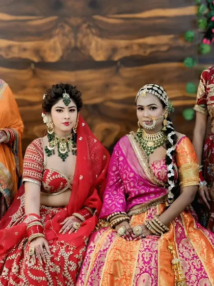 We prepare our students to handle the entire bridal party. This image showcases a beautiful bride with her bridesmaids, all styled by our talented team, demonstrating the group bridal glam skills taught at our institute.