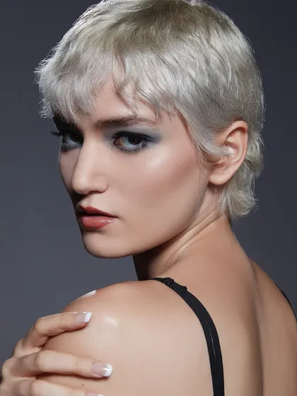 A stunning shot from our Bangalore batch's first portfolio shoot. This edgy look with a smokey eye and platinum pixie cut showcases the high-fashion aesthetic we teach.
