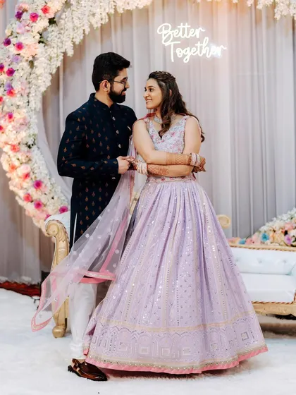 A lovely couple portrait from their engagement, with the bride in a modern lavender lehenga.