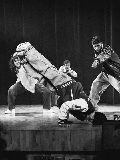 A black and white shot capturing the raw power of breaking and street dance, a core element of our instructors' performance piece.
