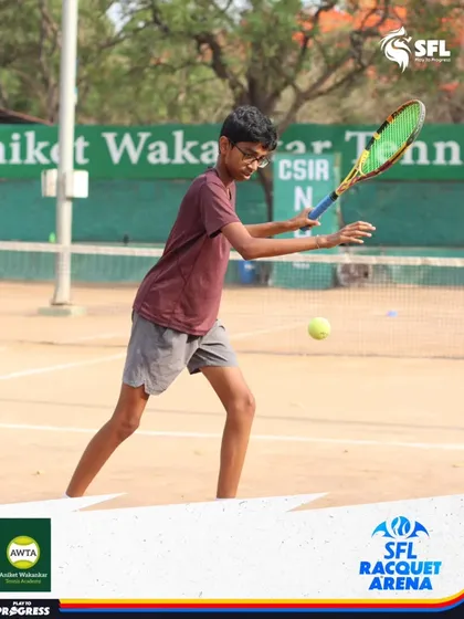 A young player lunges for a low forehand, showing the agility and determination we build in our athletes. Every point is a chance to give your all.