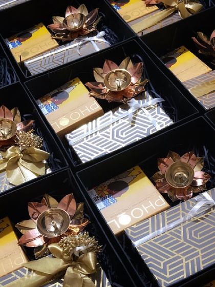 A closer look at our minimal yet festive gift hampers, featuring geometric-patterned boxes, Phool incense, and elegant lotus diyas.