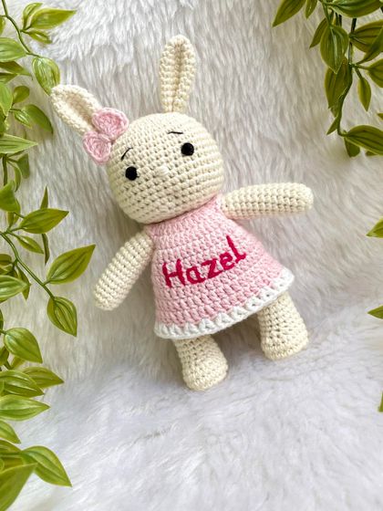 This bunny doll is personalized with the name "Hazel" on her pretty pink dress. Customizing a doll with a name makes it an extra special and personal keepsake.