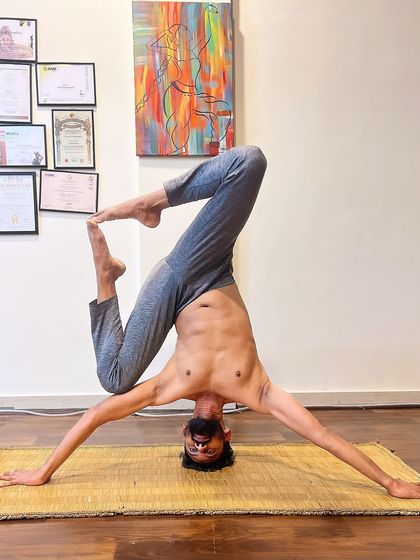 Exploring a variation of Mukta Hasta Sirsasana, or the tripod headstand. This posture challenges balance and opens the hips, requiring a great deal of concentration and stability through the shoulders and core.
