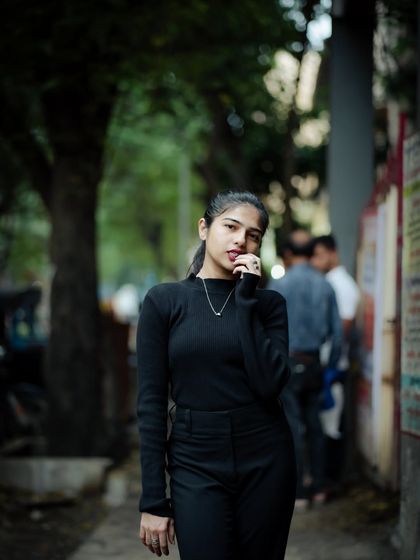A simple, beautiful portrait against a natural, leafy background. The soft light is very flattering and creates a gentle mood.
