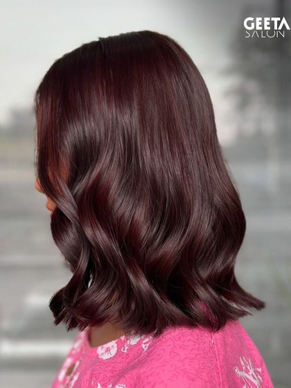 A vibrant burgundy colour on a chic bob, proving that bold colours work beautifully on shorter hair.