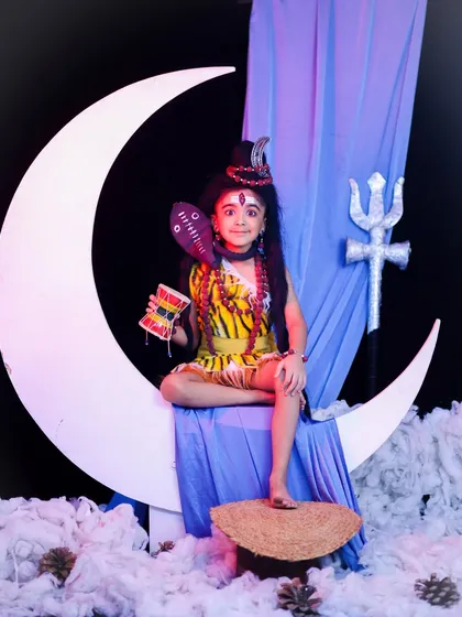 To celebrate the divine energy of your child, I offer spiritual themes like this Little Mahadev shoot. Complete with a crescent moon prop, a toy damru, and the iconic tripundra on the forehead, this is a powerful and unique way to create a memorable portrait.