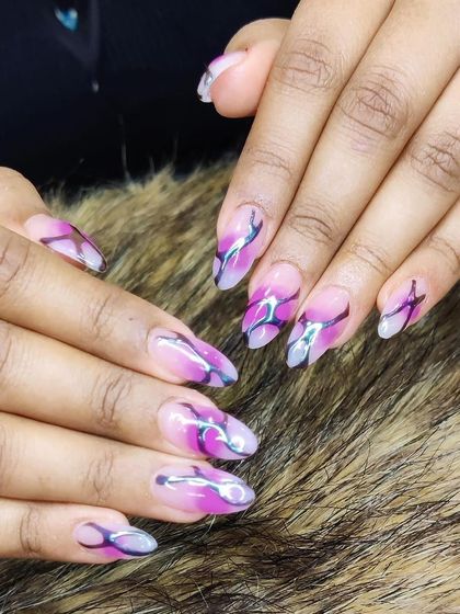 An edgy design with a pink and purple watercolor base, overlaid with abstract silver and black flame-like details.