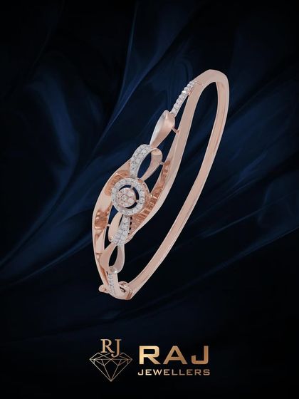 A minimalist yet sparkling bracelet with an open, swirling design centered around a CZ-studded circle. This piece is a perfect example of simple elegance.