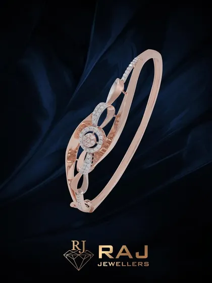 A minimalist yet sparkling bracelet with an open, swirling design centered around a CZ-studded circle. This piece is a perfect example of simple elegance.