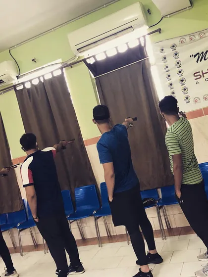 Another angle of the blindfolded stance practice. This helps shooters internalize the feeling of a perfect posture without relying on sight.