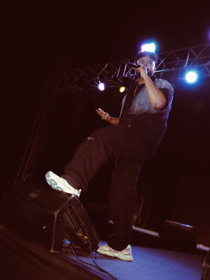 Foot on the monitor, leaning into the crowd. This is how I connect, getting as close to the energy as possible.