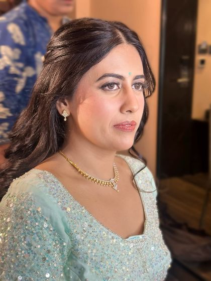 A candid, thoughtful expression, her makeup looking flawless from every angle.