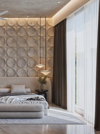 This angle showcases a feature wall of 3D circular concrete panels, creating a bold, geometric statement behind the bed.