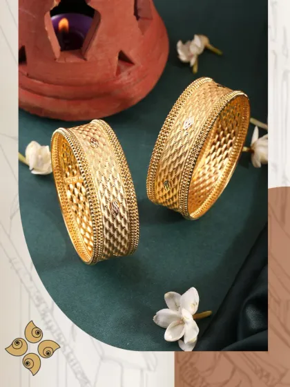Shine bright with our stunning new bangle collection. The quilted pattern on these broad gold bangles adds a modern texture to a classic design.
