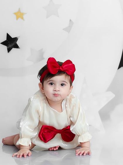 A quiet moment on the moon. This sweet crawling pose is perfect for capturing the innocence of a one-year-old.