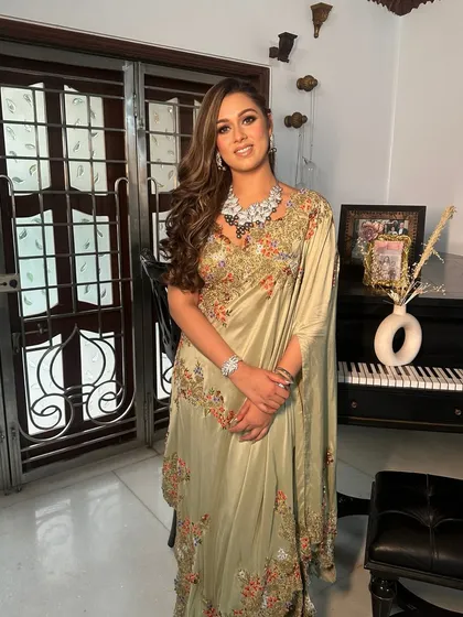 Another view of this sangeet glam, highlighting the intricate details of the outfit and the flawless, glowing makeup.