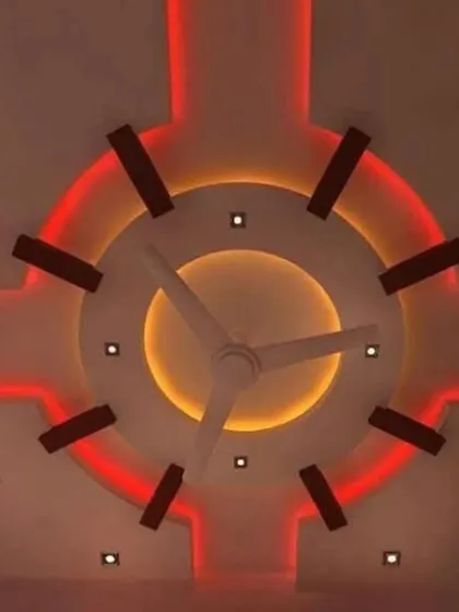 This circular design uses dual-color lighting for a striking effect. The inner circle has a warm yellow glow, while the outer ring is lit with a vibrant red, creating a fiery, sun-like appearance.