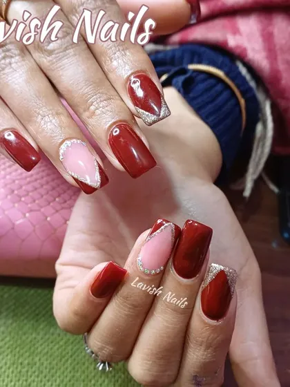 A bold design with deep red, sheer pink, and silver glitter in sharp, geometric shapes.