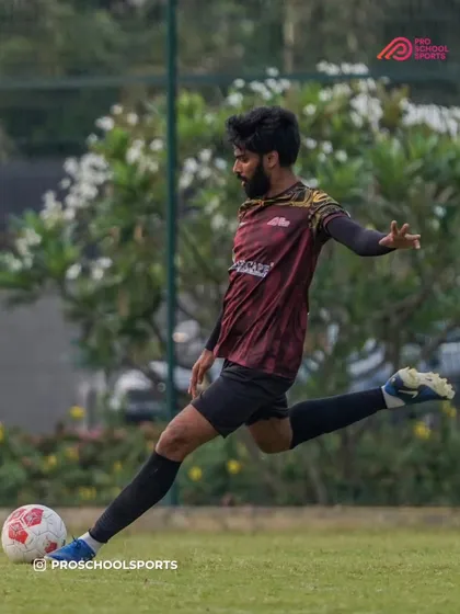 A coach demonstrates a powerful kick, a moment captured for World Photography Day.