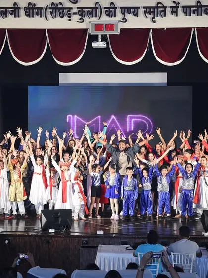 A final wave to the audience from the whole team. These big group moments are what make our annual showcase an unforgettable experience for everyone involved.